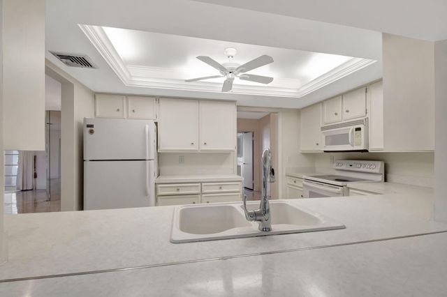 428 Pine Villa Drive, Atlantis, FL 33462