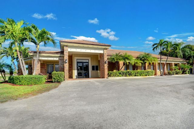 428 Pine Villa Drive, Atlantis, FL 33462