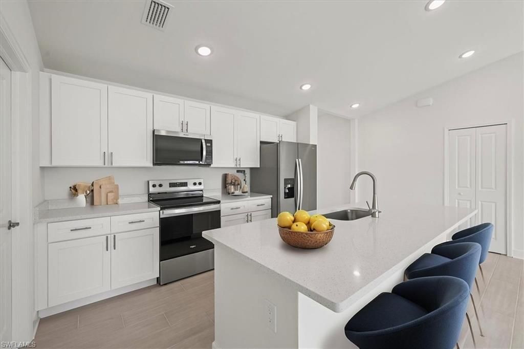 Image 3 of property listing at 1337 NW 15th PL, Cape Coral, FL 33993