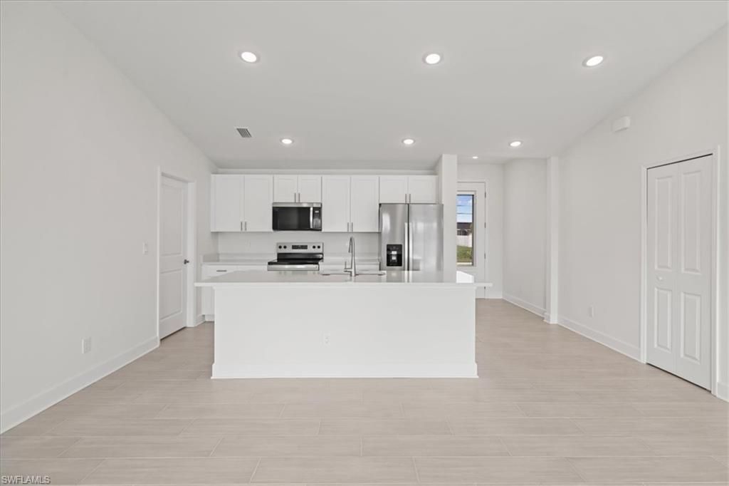 Image 6 of property listing at 1337 NW 15th PL, Cape Coral, FL 33993