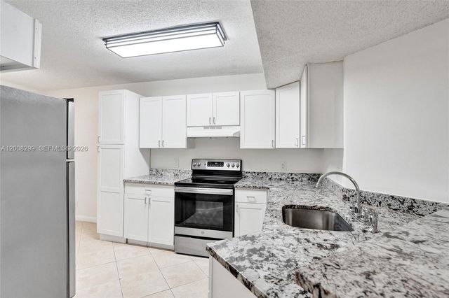 8721 Wiles Rd 101, Coral Springs, FL 33067