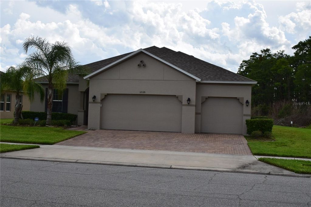 Image 1 of property listing at 12126 HOMESTEAD PARK LANE, Orlando, FL 32824