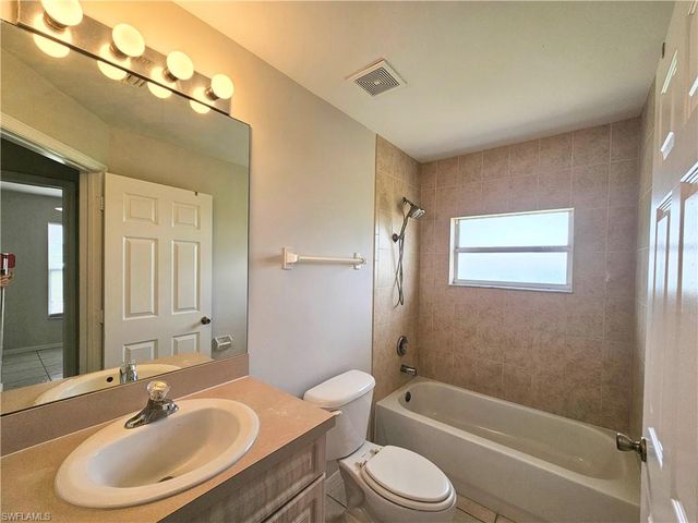 124 Ivan AVE S, Lehigh Acres, FL 33973