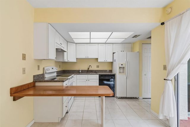 1130 ORANGE TREE CIRCLE W C, Palm Harbor, FL 34684