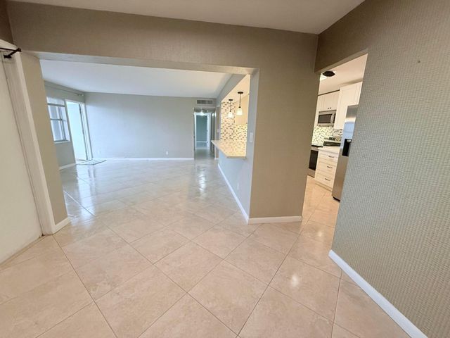 401 Golden Isles Drive, Hallandale Beach, FL 33009