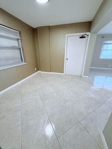 401 Golden Isles Drive, Hallandale Beach, FL 33009