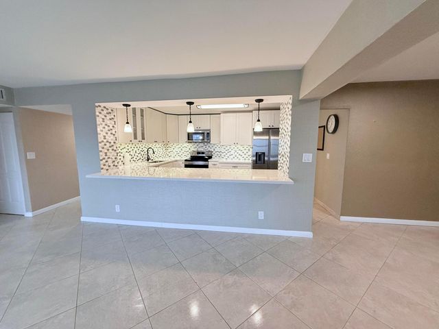 401 Golden Isles Drive, Hallandale Beach, FL 33009