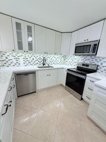 401 Golden Isles Drive, Hallandale Beach, FL 33009