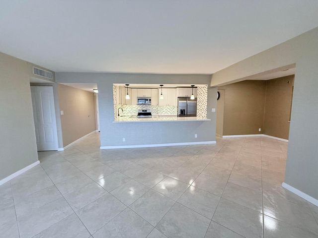 401 Golden Isles Drive, Hallandale Beach, FL 33009