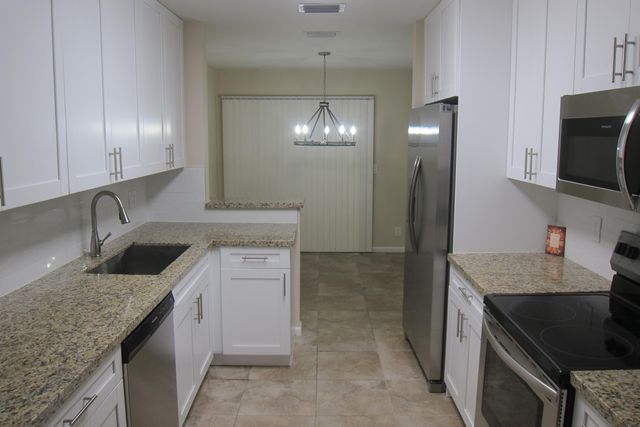 1517 Woodbridge Lakes Circle, West Palm Beach, FL 33406