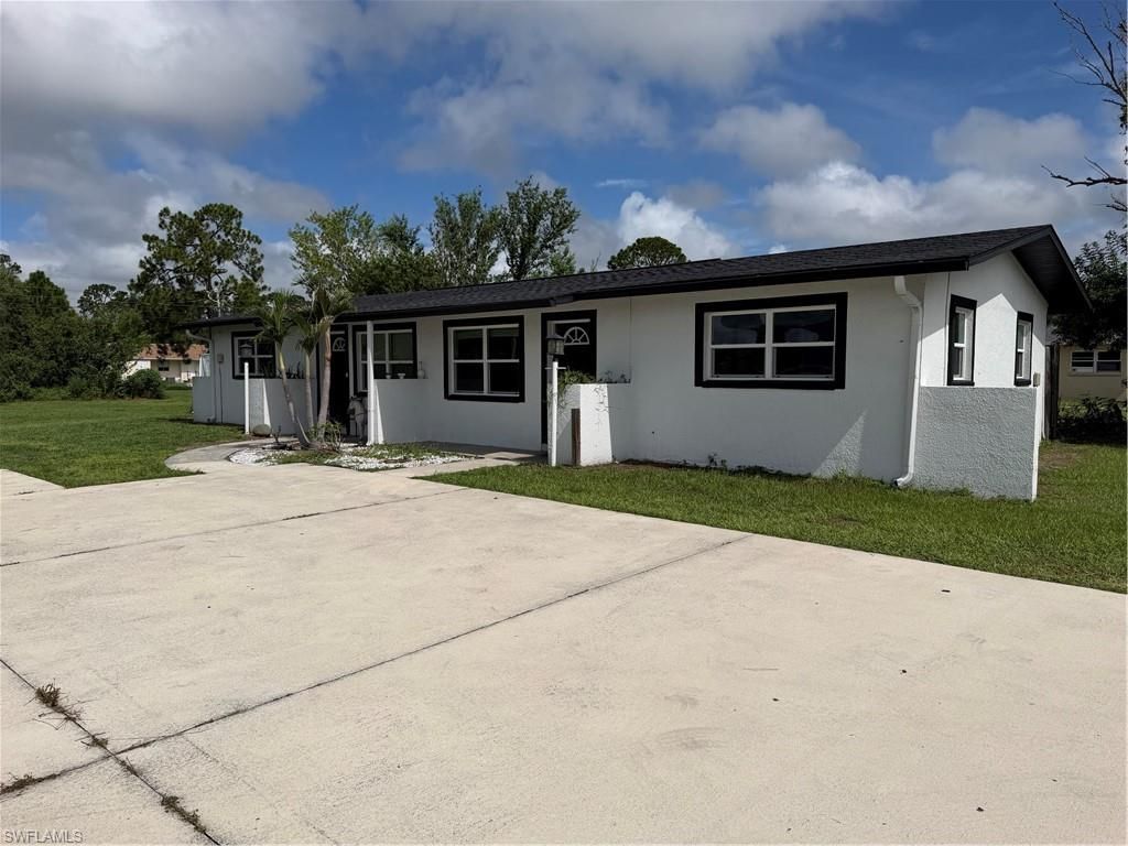 703 Joel BLVD, LEHIGH ACRES, FL 33936 — exterior