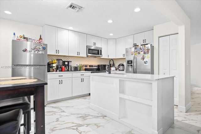 9847 Fairway Cove Lane, Plantation, FL 33324
