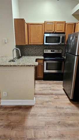 801 Lyons Rd 19203, Coconut Creek, FL 33063