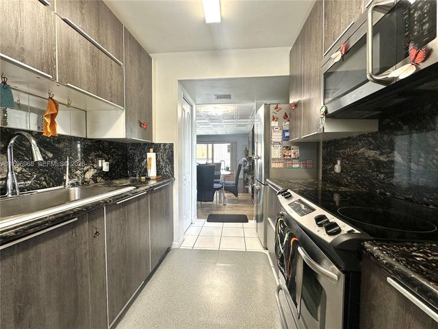 12900 SW 13th Street 214E, Pembroke Pines, FL 33027