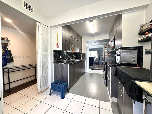 12900 SW 13th Street 214E, Pembroke Pines, FL 33027