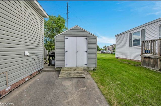 17128 Scarborough Drive, Macomb, MI 48044