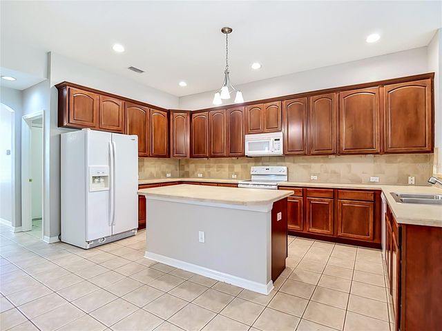 7015 CARDINALWOOD LANE, Land O Lakes, FL 34637