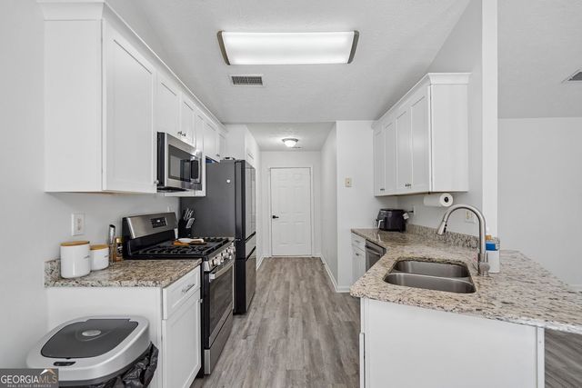1077 Woodsong Pass Court, Lawrenceville, GA 30043