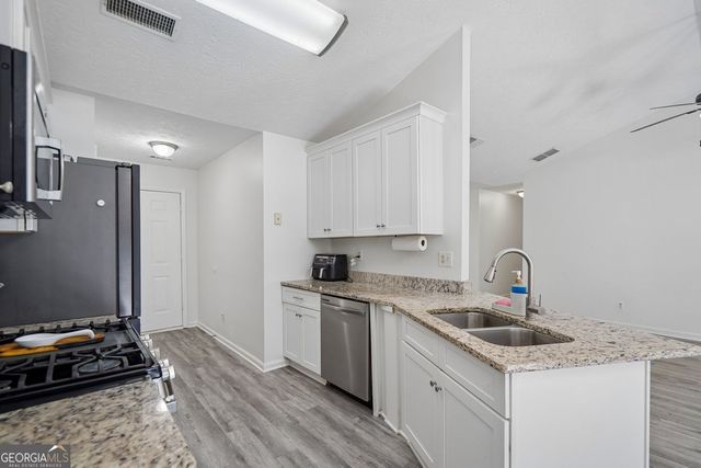1077 Woodsong Pass Court, Lawrenceville, GA 30043