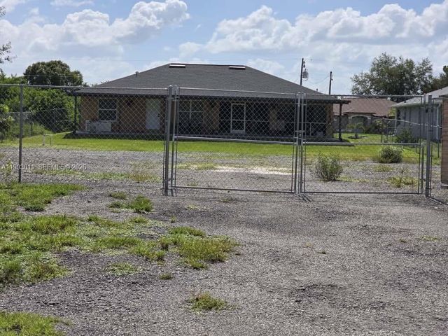 1816 Tomaso Avenue, Lehigh Acres, FL 33972