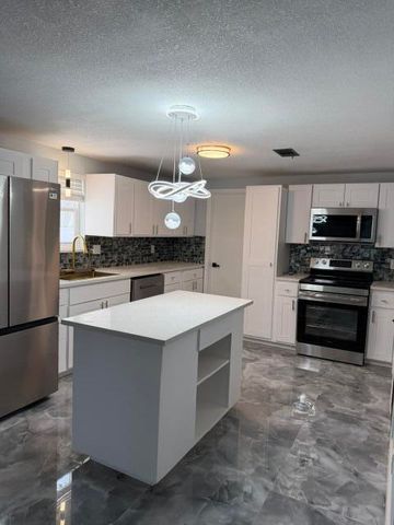 3040 TROPICAL Trail, Lake Worth, FL 33462