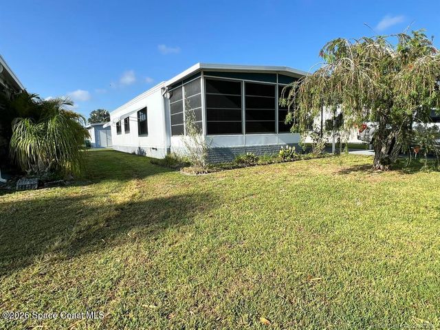 1005 Thrush Circle, Barefoot Bay, FL 32976