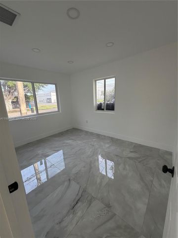 596 Ragan Dr, Miami Springs, FL 33166