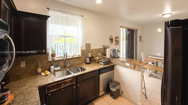 1001 NE 208th St ., Miami, FL 33179