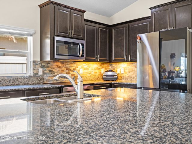 1243 Musgrass Circle, West Melbourne, FL 32904