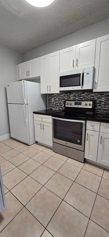 5117 Meadow Oaks Drive, Coconut Creek, FL 33073