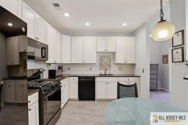 215 Bloomsbury Drive, Morganville, NJ 07751