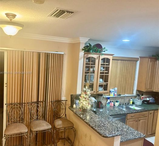 12425 NW 54th Ct, Coral Springs, FL 33076