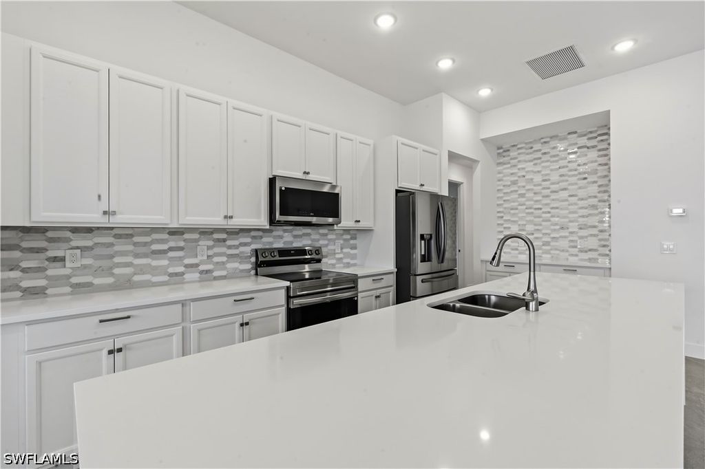 Image 3 of property listing at 1241 NW 33RD AVE, Cape Coral, FL 33993