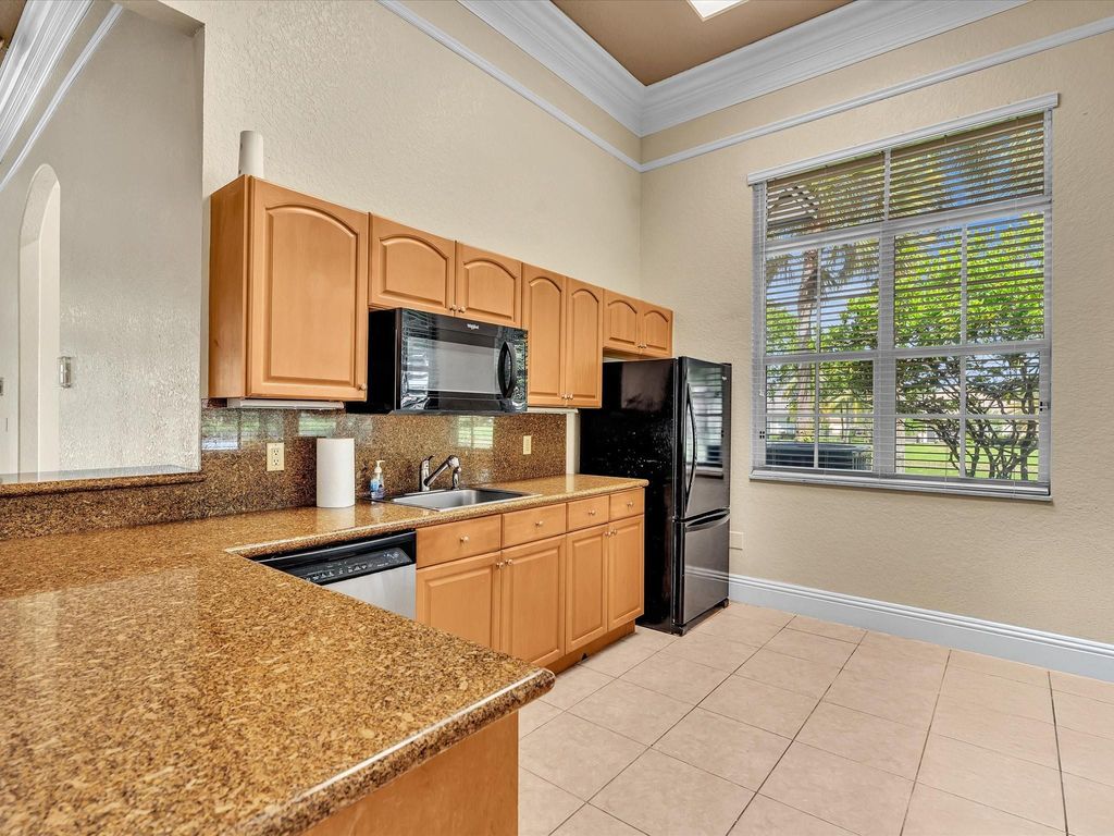Image 49 of property listing at 10986 NW 62nd Court, Parkland, FL 33076