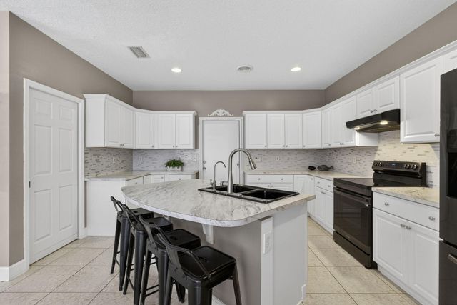 123 Fernwood Crescent, Royal Palm Beach, FL 33411