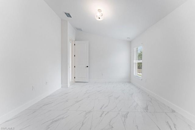 1042 Cheney AVE S, Lehigh Acres, FL 33974