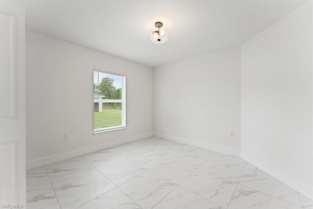 1042 Cheney AVE S, Lehigh Acres, FL 33974