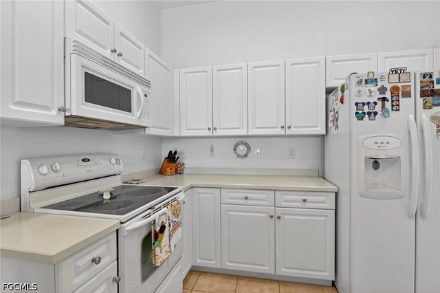 25009 Peacock LN 1-201, Naples, FL 34114