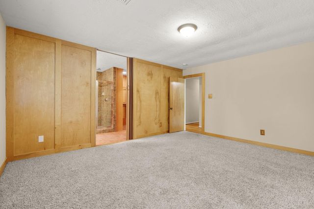 2 N Timber Top Dr, The Woodlands, TX 77380