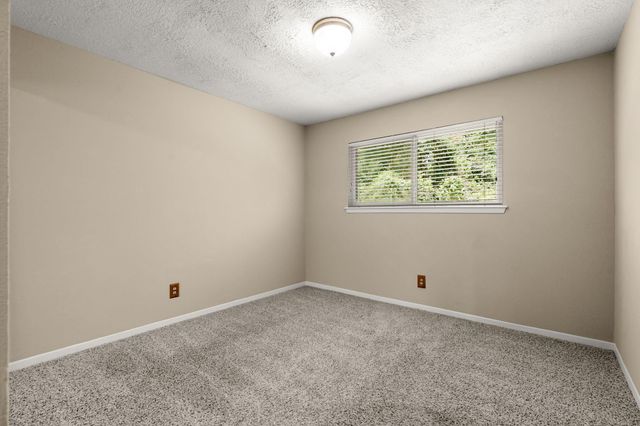 2 N Timber Top Dr, The Woodlands, TX 77380