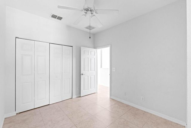 1002 Pipers Cay Drive, West Palm Beach, FL 33415