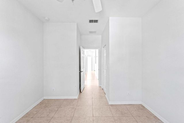 1002 Pipers Cay Drive, West Palm Beach, FL 33415