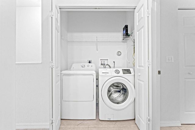 1002 Pipers Cay Drive, West Palm Beach, FL 33415