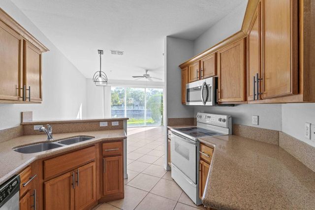 1002 Pipers Cay Drive, West Palm Beach, FL 33415