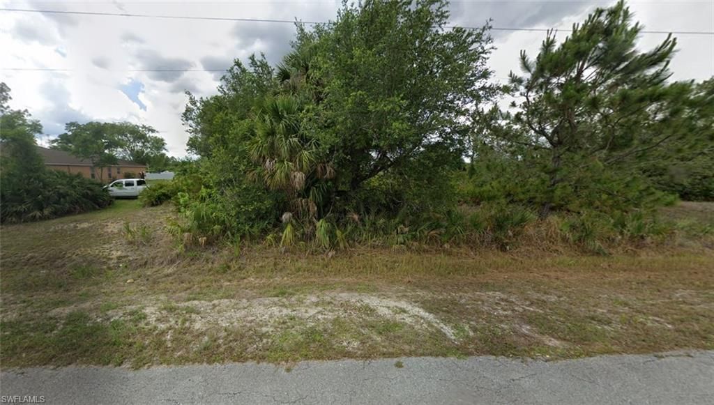 715 MCKINLEY AVE, LEHIGH ACRES, FL 33972 — exterior