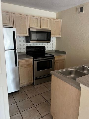 8939 LATREC AVENUE 1203, Orlando, FL 32819