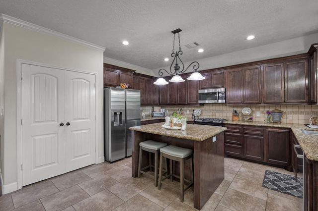 9766 Twin Shores Drive, Willis, TX 77318