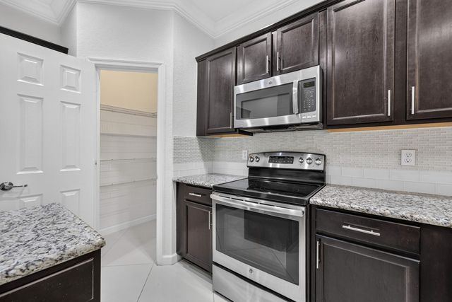 10306 WELLINGTON PARC Drive, Wellington, FL 33449