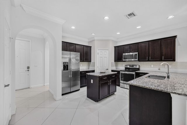 10306 WELLINGTON PARC Drive, Wellington, FL 33449