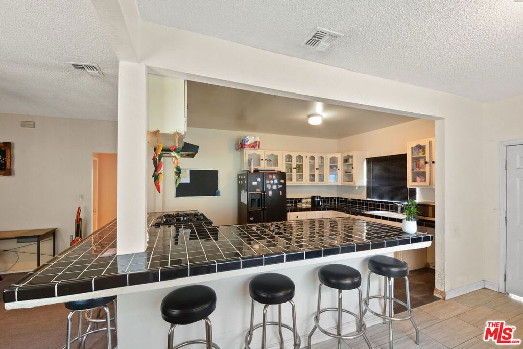 Image 4 of property listing at 1345 W 54th Street, Los Angeles, CA 90037